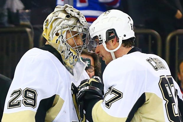 Hockey players celebrate a victory