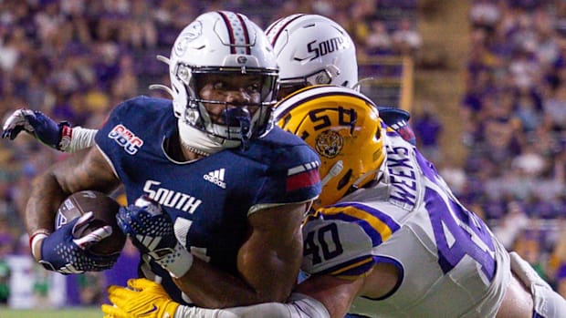 South Alabama Jaguars running back Fluff Bothwell (24) is tackled by LSU Tigers linebacker Whit Weeks (40).