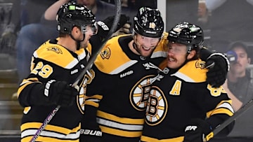 Nov 7, 2024; Boston, Massachusetts, USA;  Boston Bruins center Pavel Zacha (18) is congratulated by defenseman Parker Wotherspoon (29) and right wing David Pastrnak (88) after scoring a goal during the second period against the Calgary Flames at TD Garden. Mandatory Credit: Bob DeChiara-Imagn Images