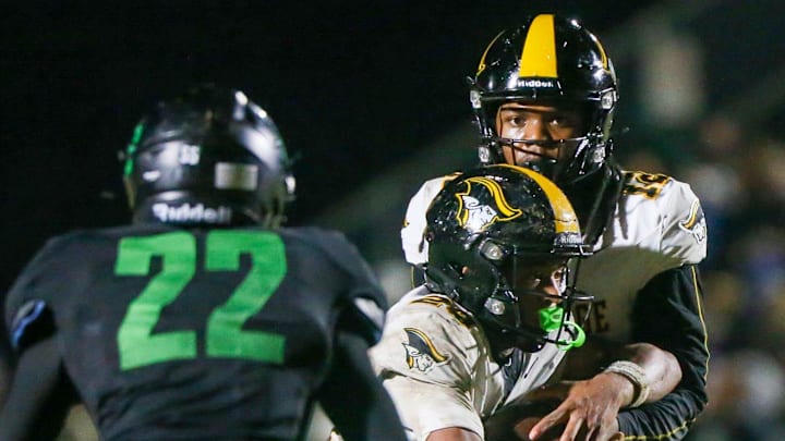 American Heritage QB Leon Strawder, shown here in an earlier game against Choctawhatchee, completed 12 of 18 passes for 173 yards and two TDs and rushed eight times for 72 yards and one score to march the Patriots past Orlando Jones, 33-28, in the Class 4A state title game on Dec. 13, 2025.