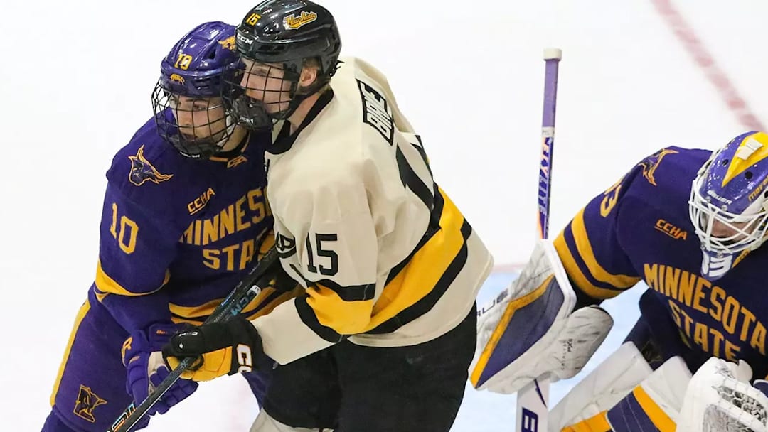 Minnesota State's Evan Murr and Alex Tracy protect the net against Michigan Tech.