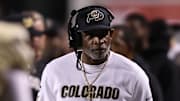 Oct 25, 2025; Salt Lake City, Utah, USA; Colorado Buffaloes head coach Deion Sanders looks on during a time out in the game against the Utah Utes during the second quarter at Rice-Eccles Stadium. Mandatory Credit: Rob Gray-Imagn Images