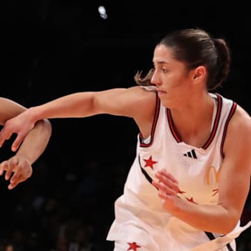 Apr 1, 2025; Brooklyn, NY, USA; McDonald's All American East wing Nyla Brooks (7) dribbles the ball against McDonald's All American West guard Addie Deal (7) during the second half of the game at Barclays Center. Mandatory Credit: Pamela Smith-Imagn Images