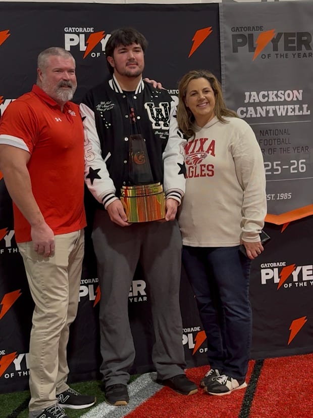 Jackson Cantwell and his parents after being surprised with the National Football Gatorade Player of the year award