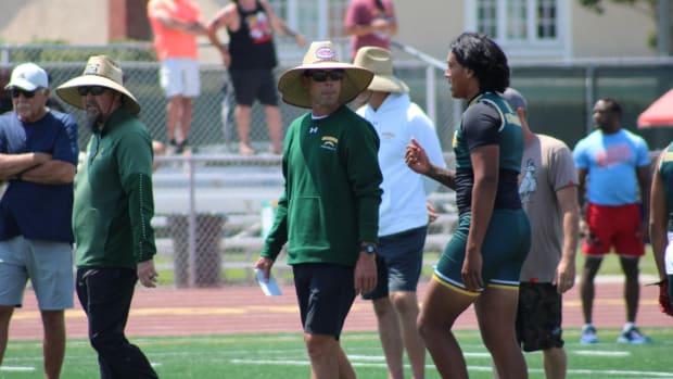 Edison football coach Jeff Grady (left) and QB Savelio Niumata at Battle at the Beach.