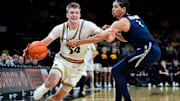 Iowa Hawkeyes guard Bennett Stirtz drives against the Xavier Musketeers