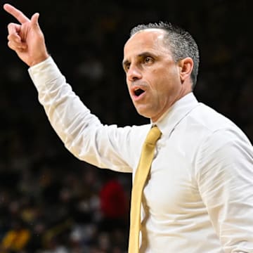 Iowa Hawkeyes head coach Ben McCollum