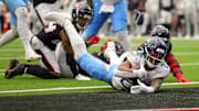 Tennessee Titans running back Tony Pollard diving for a score against the Houston Texans