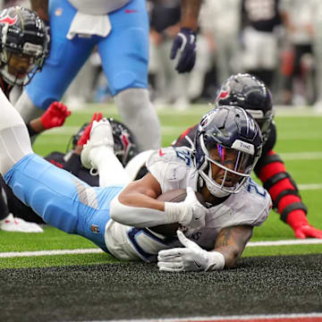 Tennessee Titans running back Tony Pollard diving for a score against the Houston Texans