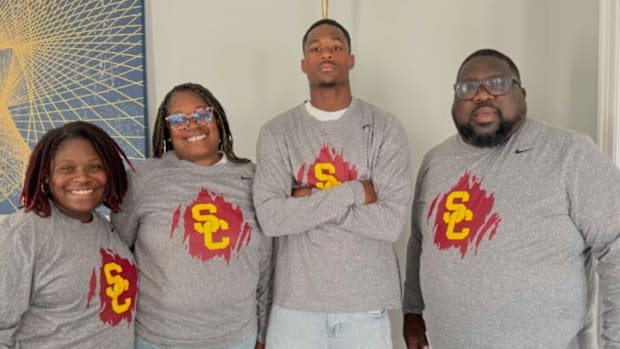 Ethan "Boobie" Feaster of Desoto High in Texas shared his commitment day announcement with his family.