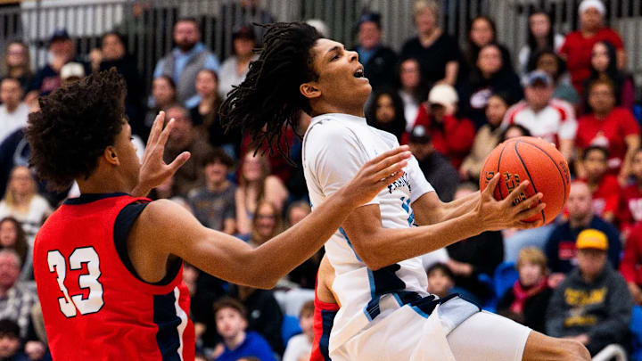Justice Samuels of Franklin converts and-1 during semifinals matchup against Central Catholic at Worcester State University