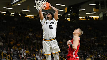 Iowa Hawkeyes guard Tavion Banks throwing down a dunk against the Robert Morris Colonials
