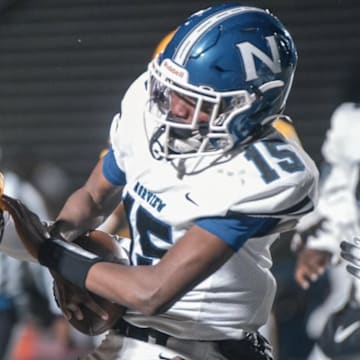 Warwick High School LB Tracy Pope Jr. makes a critical tackle against Norview.