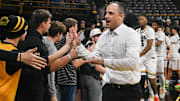 Iowa Hawkeyes head coach Ben McCollum