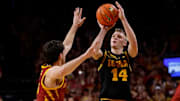 Iowa Hawkeyes guard Bennett Stirtz rises up for a shot against the Iowa State Cyclones