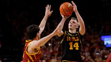 Iowa Hawkeyes guard Bennett Stirtz rises up for a shot against the Iowa State Cyclones