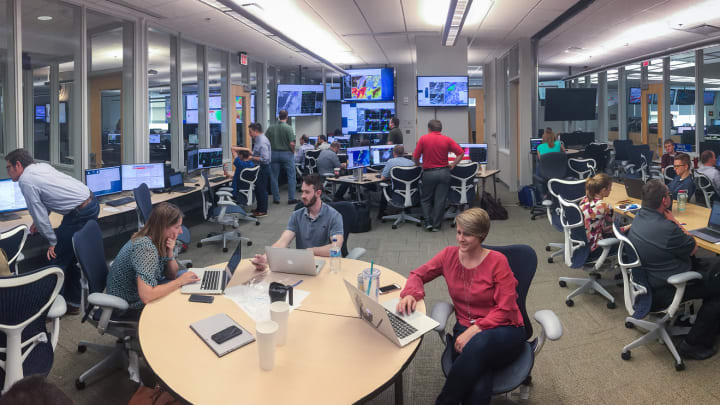 NOAA scientists in a weather forecasting laboratory