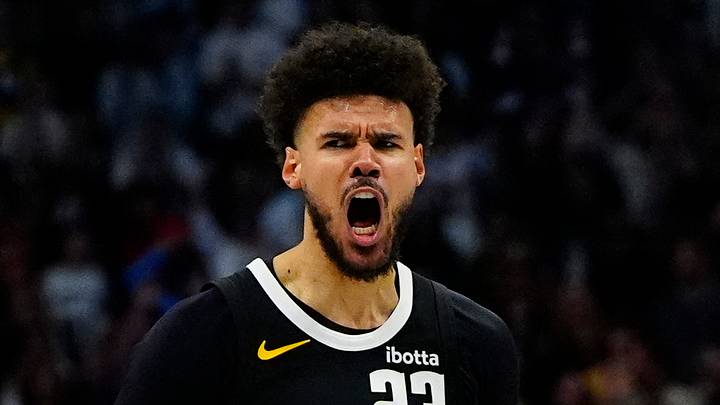 Apr 4, 2026; Denver, Colorado, USA; Denver Nuggets forward Cameron Johnson (23) reacts to his three point score in overtime against the San Antonio Spurs at Ball Arena. Mandatory Credit: Ron Chenoy-Imagn Images