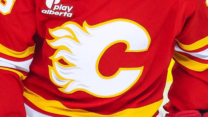 Jan 19, 2026; Calgary, Alberta, CAN; Calgary Flames defenseman Zach Whitecloud (28) skates during the warmup period against the New Jersey Devils at Scotiabank Saddledome. Mandatory Credit: Sergei Belski-Imagn Images