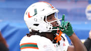 Nov 29, 2025; Pittsburgh, Pennsylvania, USA;  Miami Hurricanes wide receiver Malachi Toney (10) reacts after catching a touchdown pass against the Pittsburgh Panthers during the second quarter at Acrisure Stadium. Mandatory Credit: Charles LeClaire-Imagn Images