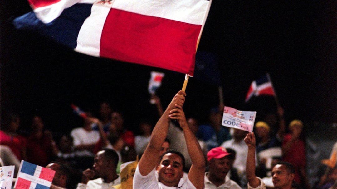 Mar 3, 2000; Santo Domingo, Dominican Republic; Fans of the Dominican Republic  wave the national flag during the Caribbean World Series. The Caribbean World Series, a round robin elimination series with Puerto Rico winning the championship, was played at the Estadio Quisqueya (Quisqueya stadium) in the capital of Santo Domingo.