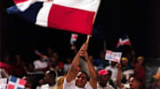 Mar 3, 2000; Santo Domingo, Dominican Republic; Fans of the Dominican Republic  wave the national flag during the Caribbean World Series. The Caribbean World Series, a round robin elimination series with Puerto Rico winning the championship, was played at the Estadio Quisqueya (Quisqueya stadium) in the capital of Santo Domingo.