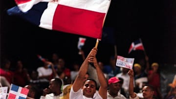 Mar 3, 2000; Santo Domingo, Dominican Republic; Fans of the Dominican Republic  wave the national flag during the Caribbean World Series. The Caribbean World Series, a round robin elimination series with Puerto Rico winning the championship, was played at the Estadio Quisqueya (Quisqueya stadium) in the capital of Santo Domingo.