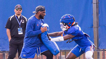 New Florida secondary coach Will Harris runs a drill with one of his defensive backs during the Florida Gators as they held their final open Spring football practice before the Orange and Blue Game at Sanders Practice Fields in Gainesville, FL on Tuesday, April 9, 2024. [Doug Engle/Gainesville Sun]
