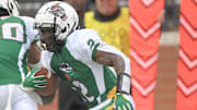 North Carolina receiver Jonathan Paylor of Hugh M. Cummings High, committed to NC State runs during the fourth quarter of the Shrine Bowl of the Carolinas football game at Viking Stadium in Spartanburg, S.C. Saturday, December 16, 2023.