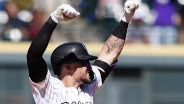 Colorado Rockies outfielder Brenton Doyle (9) reacts after a two run double