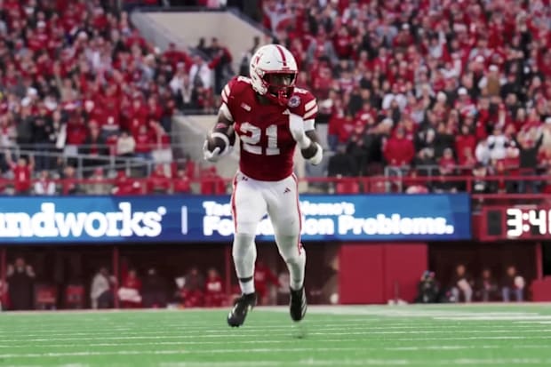 Emmett Johnson runs with a catch for a big gain  against Wisconsin on Nov. 23, 2024 in Lincoln.