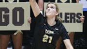 Purdue defensive specialist Julia Kane (21) serves the ball 