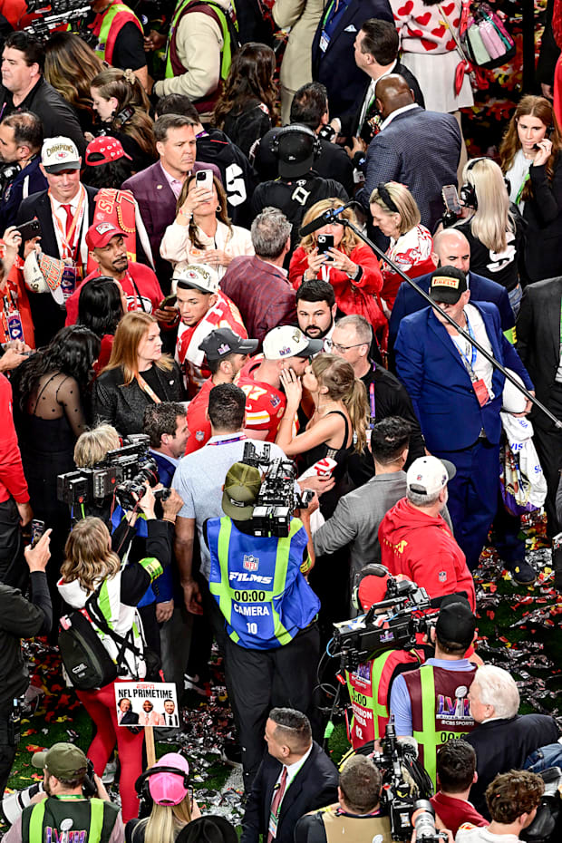 Kansas City Chiefs Travis Kelce (kisses girlfriend and singer Taylor Swift after winning the Super Bowl.