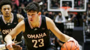 Omaha forward Frankie Fidler (23) drives to the net during the first half of an NCAA men's