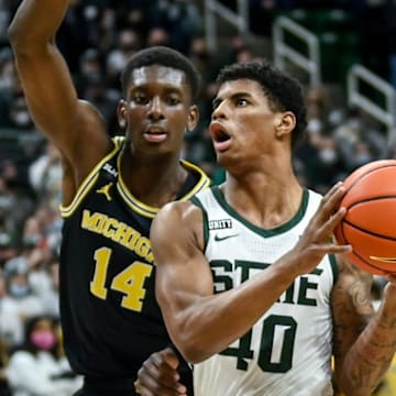 Michigan State's Keon Coleman, right, drives to the basket as Michigan's Moussa Diabate defends during the second half on Saturday, Jan. 29, 2022, at the Breslin Center in East Lansing