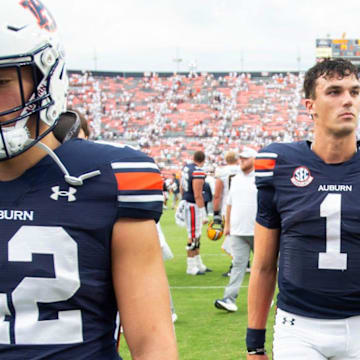 Auburn Tigers quarterback Payton Thorne walks off the field after a four-interceptions performance in a 21-14 loss to Cal.