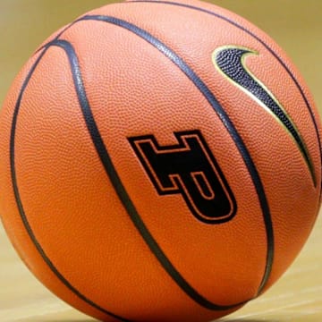 A NCAA women's basketball with the Purdue University logo 