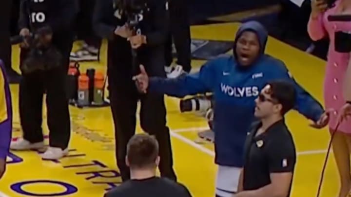 Minnesota Timberwolves guard Anthony Edwards talks to Los Angeles Lakers guard Luka Doncic before Game 2.