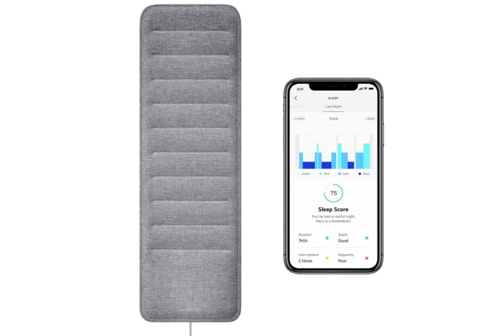 Withings Sleep Tracking Pad next to a smartphone displaying the brand's app on a white background.