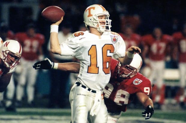 Nebraska's Grant Wistrom hits Tennessee's Peyton Manning during the 1998 Orange Bowl.