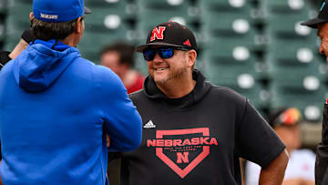 Nebraska head coach, Will Bolt, meets Creighton head coach, Ed Servais, at home plate prior to the game at Haymarket Park. 