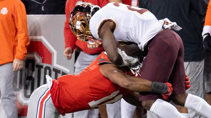 Nov 18, 2023; Columbus, Ohio, USA; 
Ohio State Buckeyes linebacker C.J. Hicks (11) tackles Minnesota Golden Gophers running back Sean Tyler (2) during the second half of their game on Saturday, Nov. 18, 2023 at Ohio Stadium.