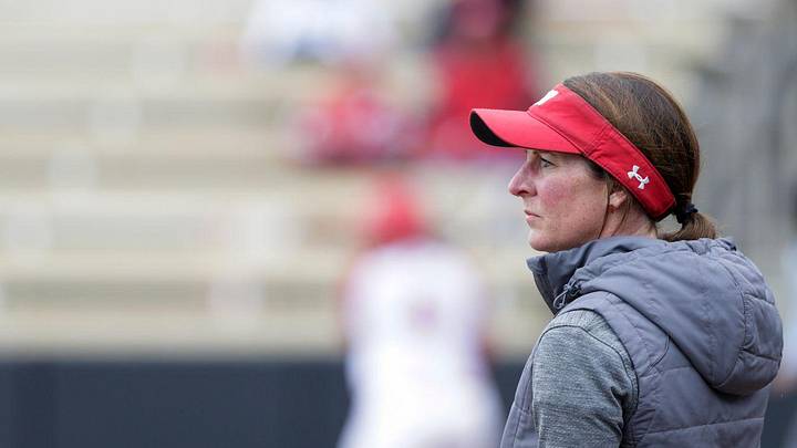 Wisconsin head coach Yvette Healy watches the play during the first inning of a NCAA softball game.