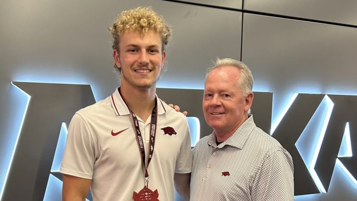 Arkansas Razorbacks quarterback commit Grayson Wilson with Razorbacks offensive coordinator Bobby Petrino during the 2024 Hog Wild Hangout.