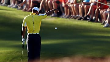 Tiger Woods drops his ball on the 15th hole at Augusta National during the 2013 Masters
