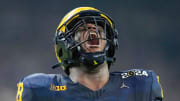 Michigan defensive lineman Kenneth Grant (78) celebrates a sack on Washington quarterback Michael Penix Jr. (9) in the second quarter during the College Football Playoff national championship game against Washington at NRG Stadium in Houston, Texas on Monday, January 8, 2024.