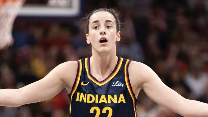 Caitlin Clark of the Indiana Fever reacts to a foul called in the first half of the game against the Seattle Storm at Gainbridge Fieldhouse on August 18, 2024 in Indianapolis, Indiana. 