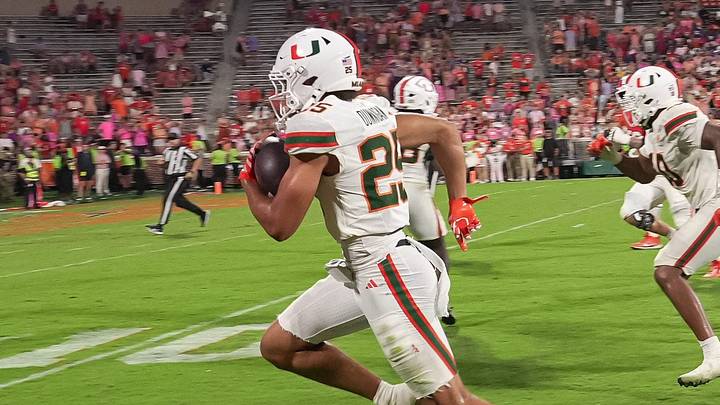 Miami Hurricanes defensive back JJ Dunnigan (25) scores on an interception against Clemson during the fourth quarter at Memorial Stadium Saturday, October 3, 2026.