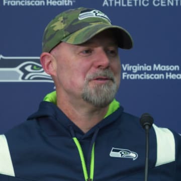 Seahawks offensive coordinator Ryan Grubb chats with reporters following the team's seventh OTA practice.