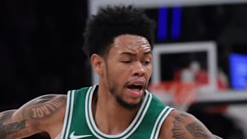 Oct 24, 2025; New York, New York, USA;  New York Knicks guard Mikal Bridges (25) dribbles as Boston Celtics guard Anfernee Simons (4) defends during the first half at Madison Square Garden. Mandatory Credit: Vincent Carchietta-Imagn Images